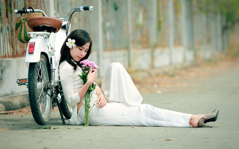 Woman in white with flowers