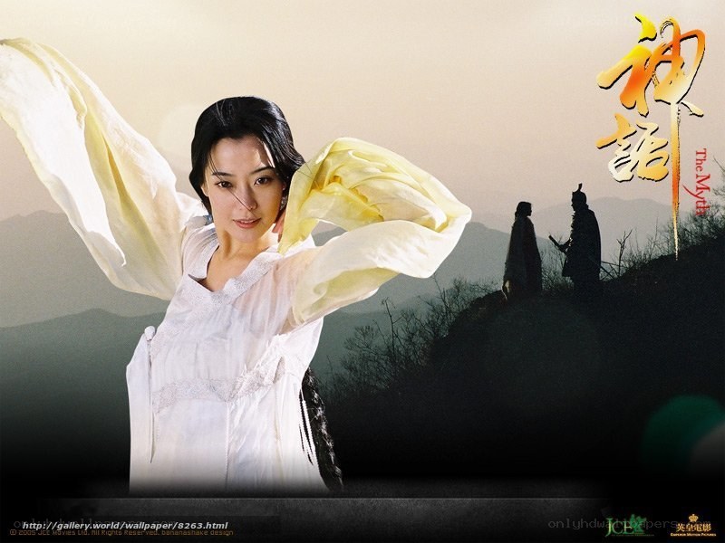 Woman in white with flowing scarf