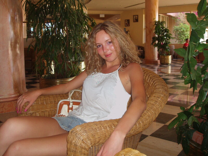 Woman in Wicker Chair — White
