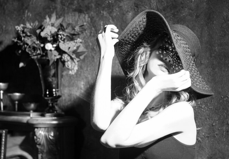 Woman in Wide-brimmed Hat — Black, Dramatic, Photograph, Flowers
