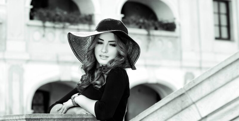 Woman in Wide-brimmed Hat — Black, Serene, Photograph