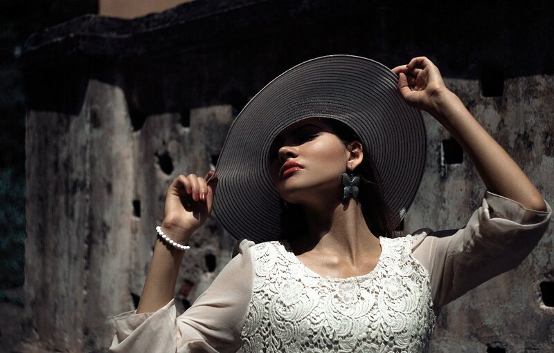 Woman in Wide-brimmed Hat — White, Dramatic