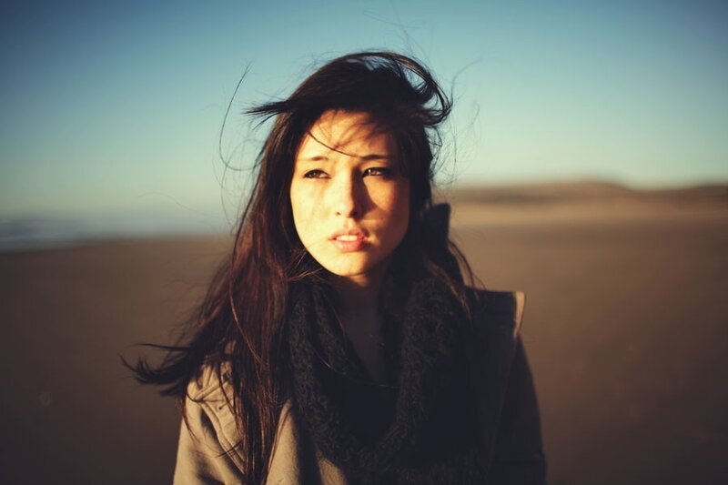 woman in wind on beach