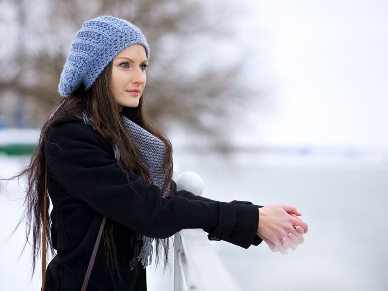 woman in winter by the water