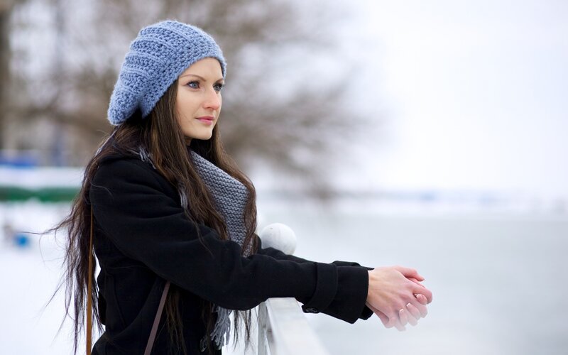 woman in winter by the water