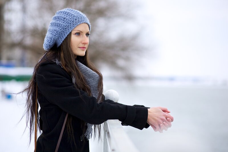 woman in winter by the water