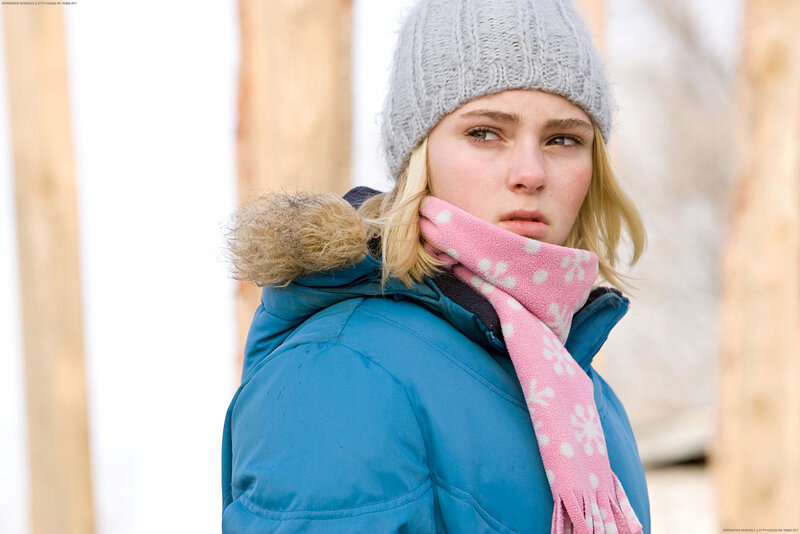 woman in winter clothes looking away
