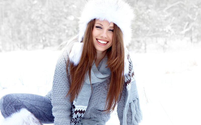 woman in winter clothes smiling