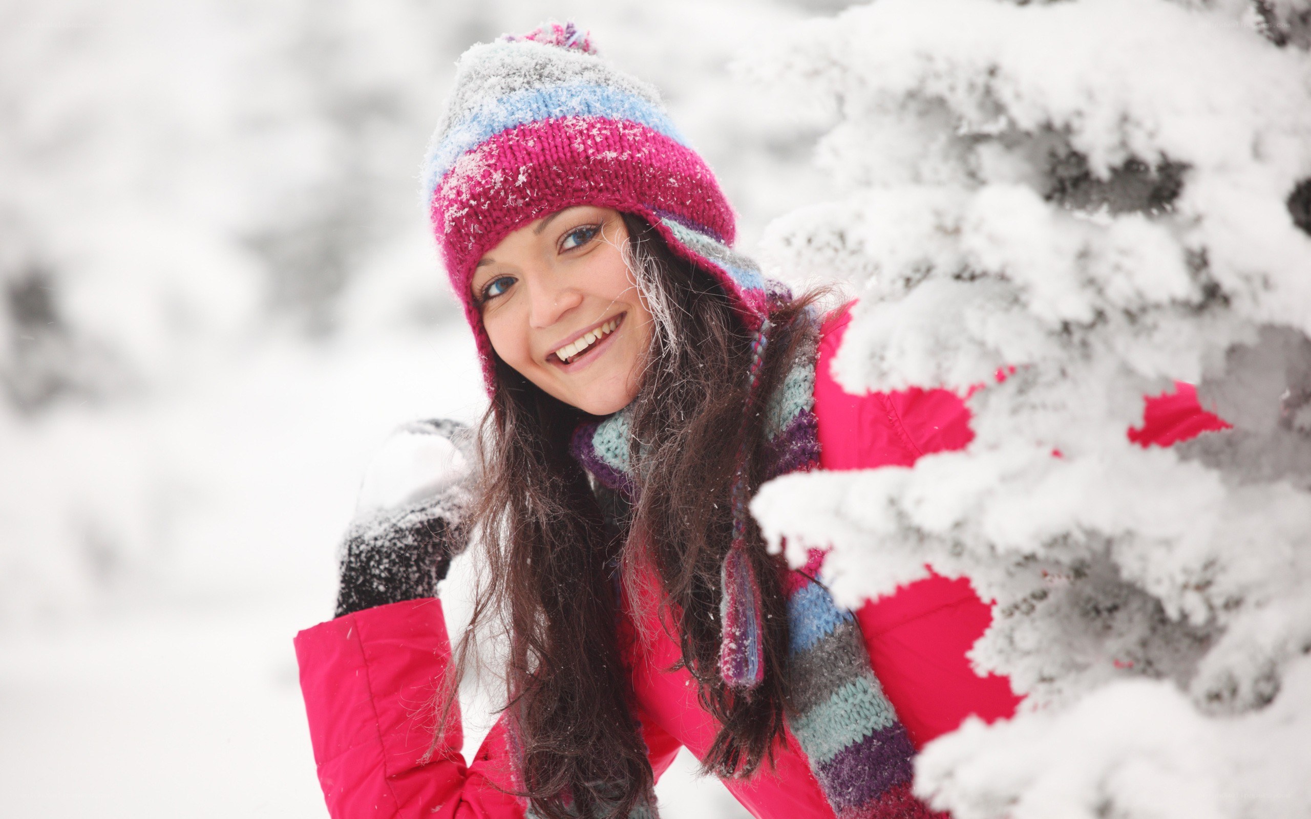 woman in winter clothes smiling