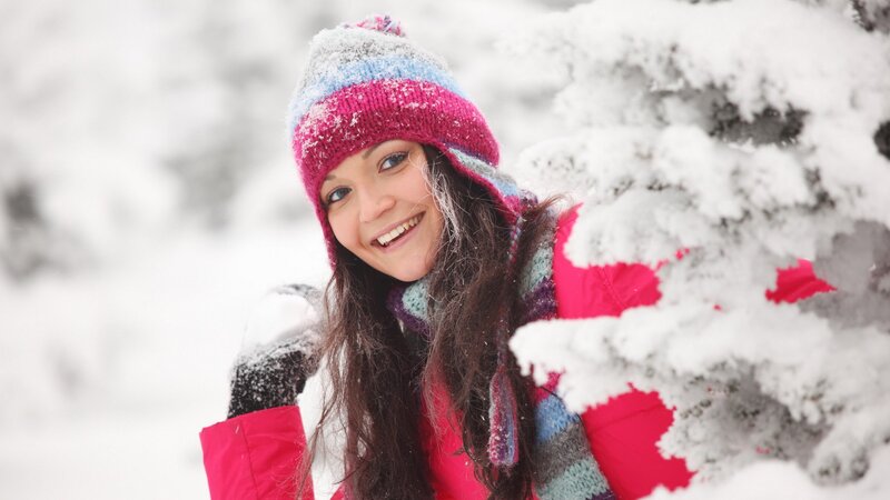 woman in winter clothes smiling