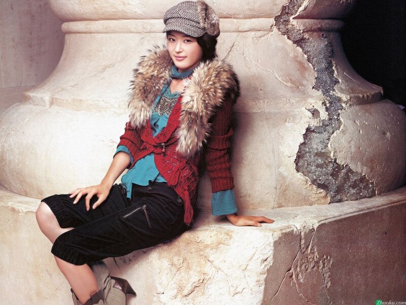 woman in winter clothing sitting