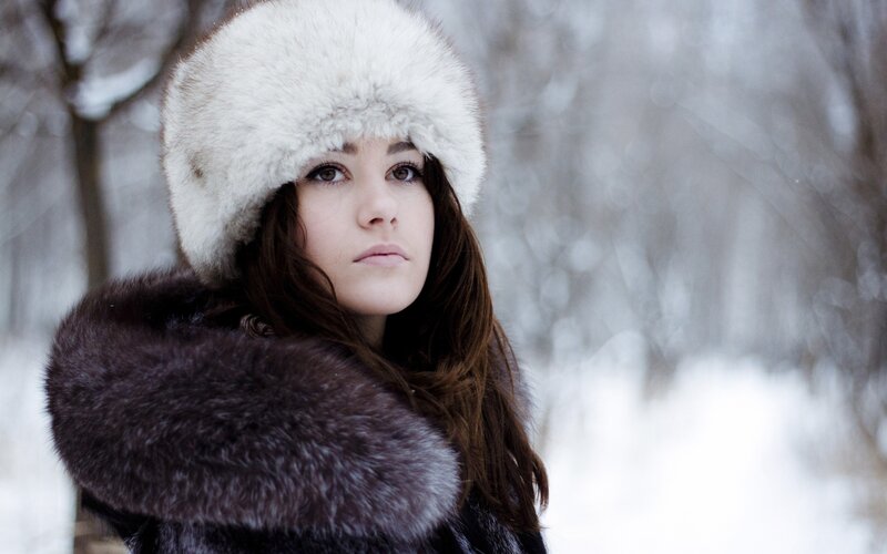 woman in winter coat and hat