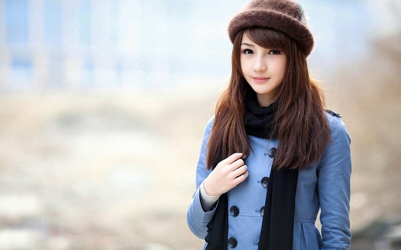 woman in winter coat and hat