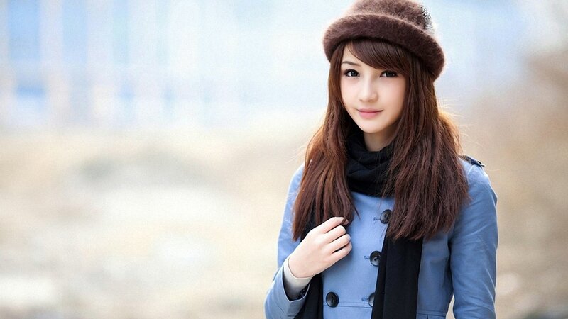 woman in winter coat and hat