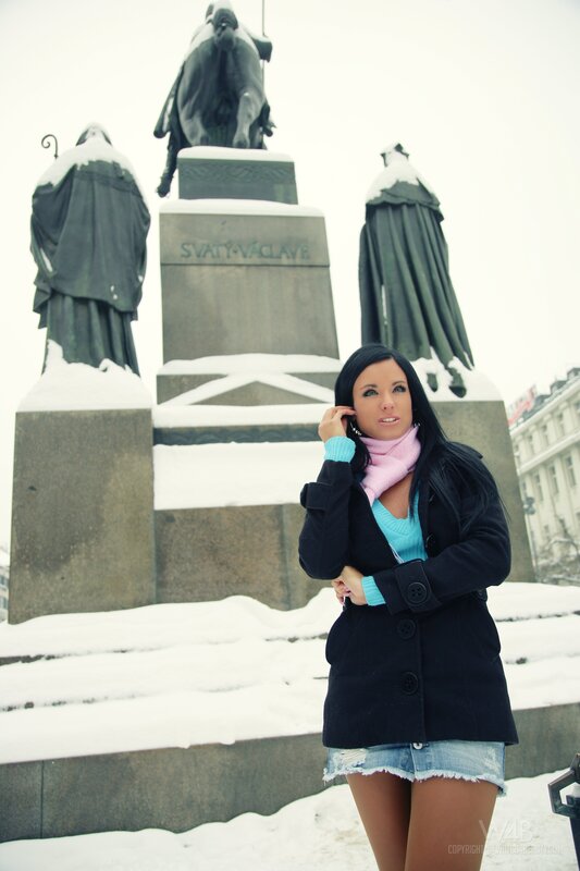 Woman in winter coat at monument