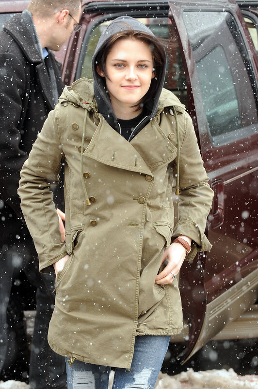 woman in winter coat during snow