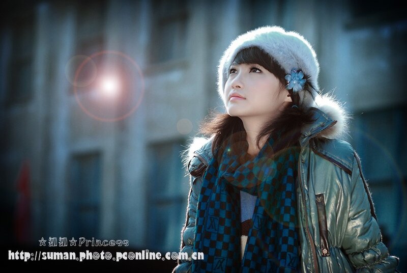 woman in winter coat looking up