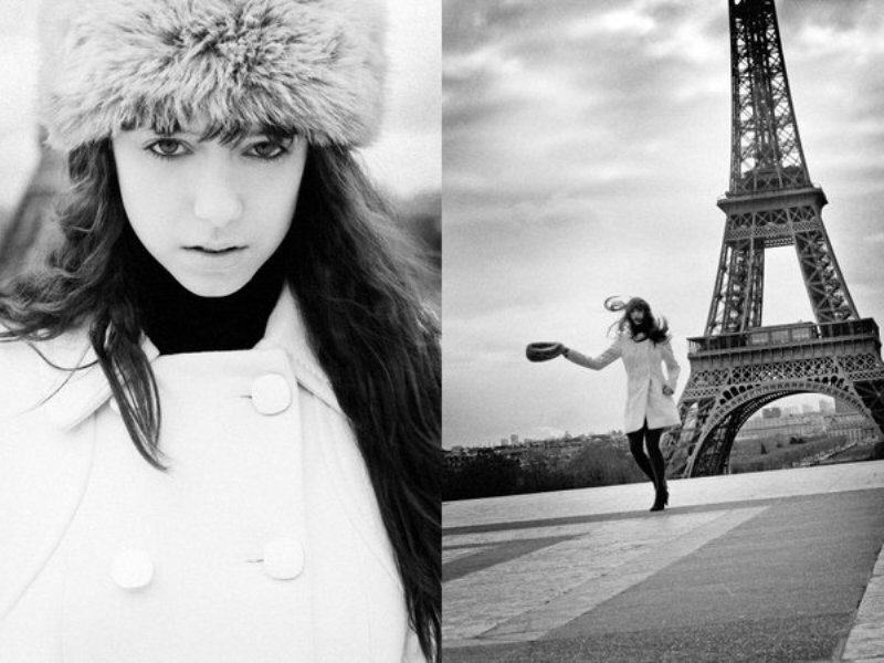 woman in winter coat near eiffel tower