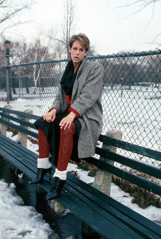 Woman in winter coat on bench