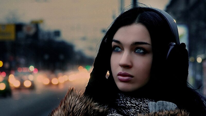 woman in winter coat on city street