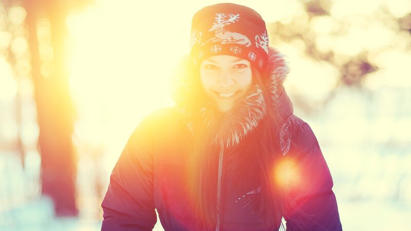 woman in winter coat smiling