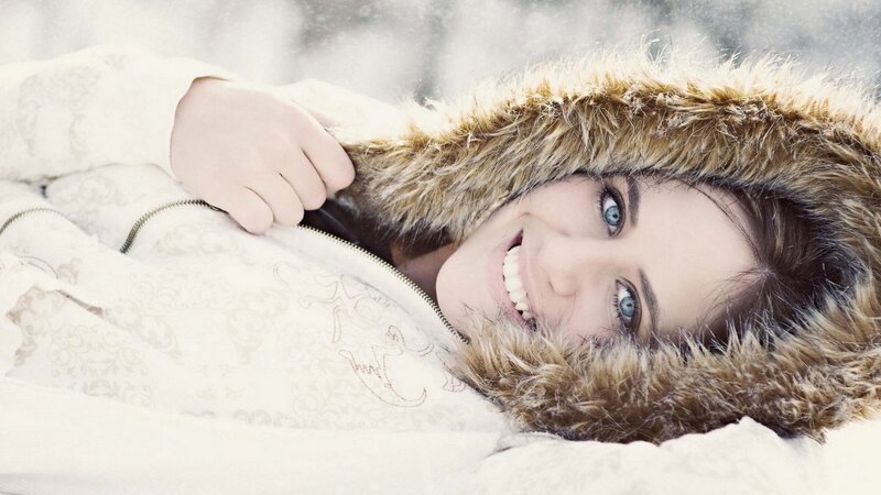 woman in winter coat smiling