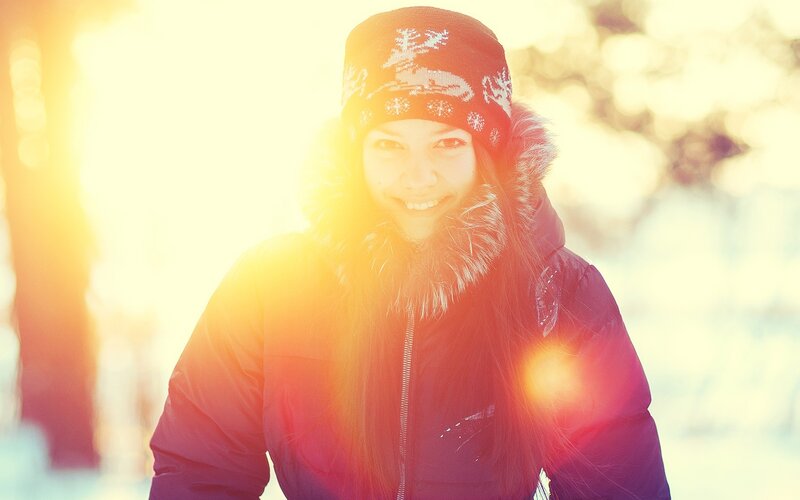 woman in winter coat smiling