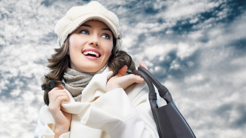woman in winter coat smiling