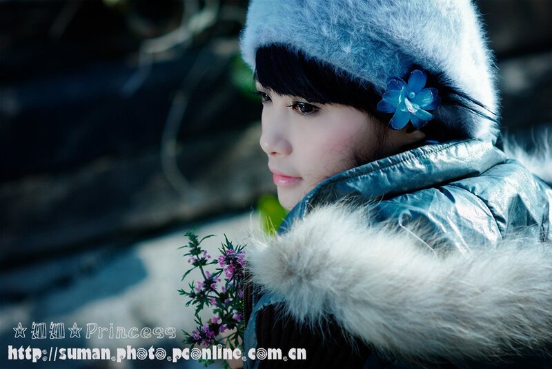 woman in winter coat with flowers