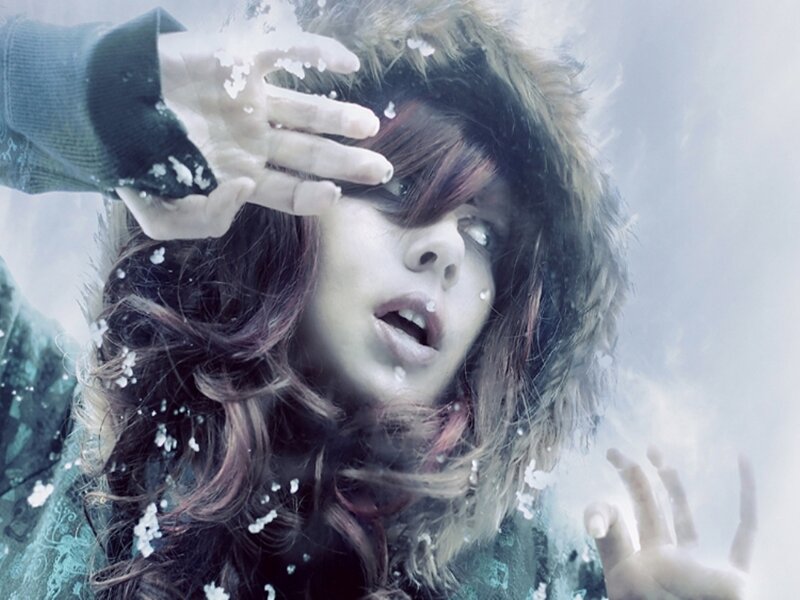 woman in winter coat with snow