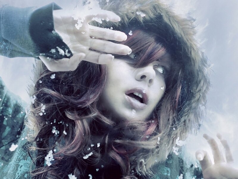 woman in winter coat with snow