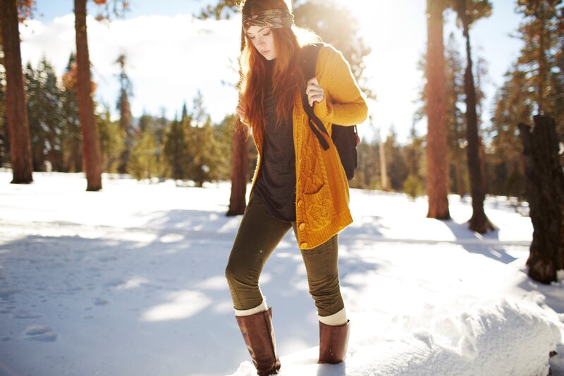Woman in winter forest