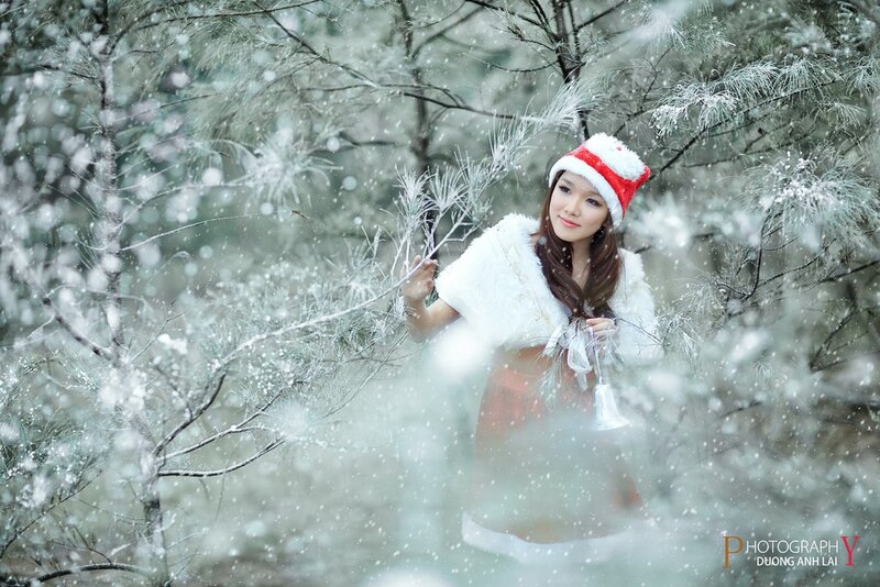 Woman in winter forest with snow