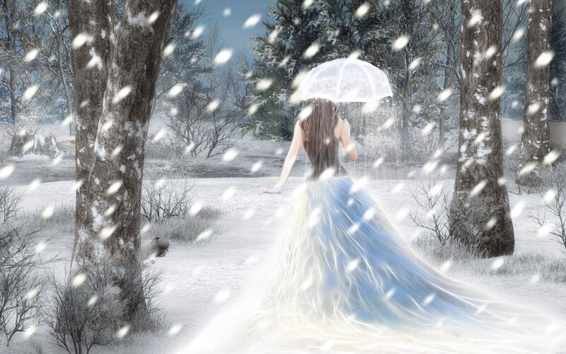 Woman in winter forest with umbrella