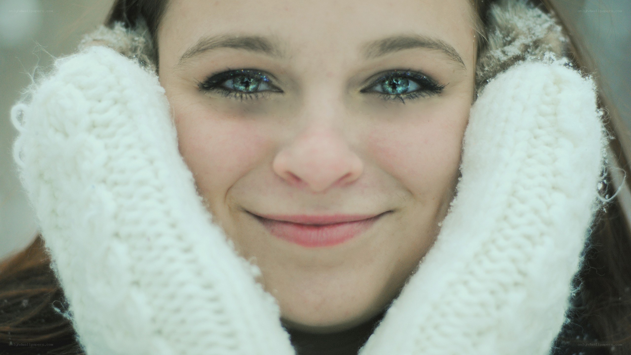 woman in winter gloves smiling