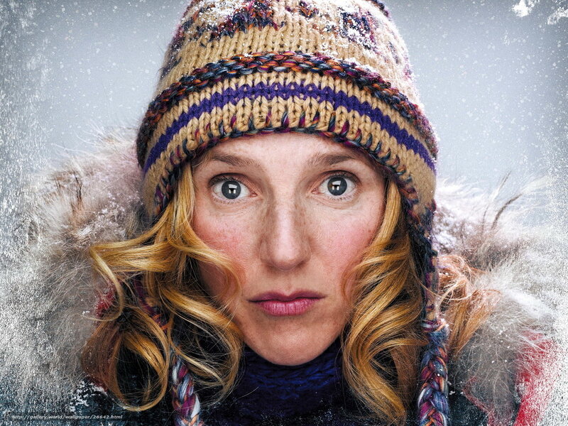 woman in winter hat in snow