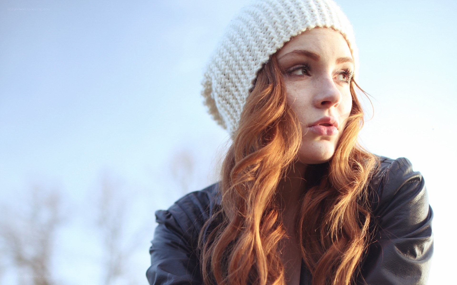 woman in winter hat looking away