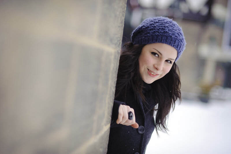 woman in winter hat peeking