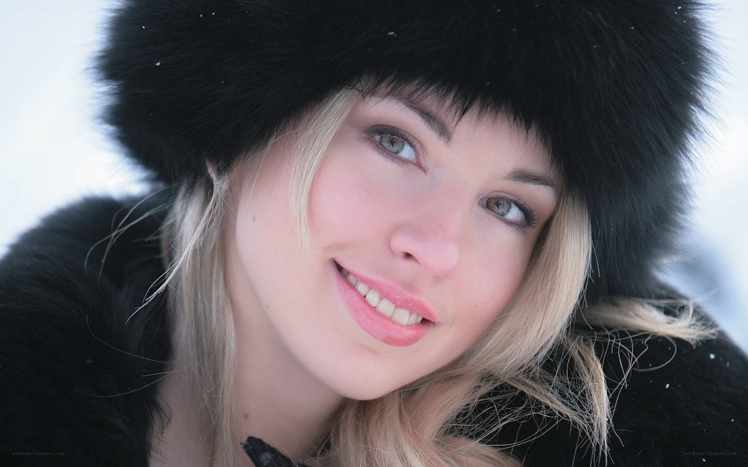 woman in winter hat smiling
