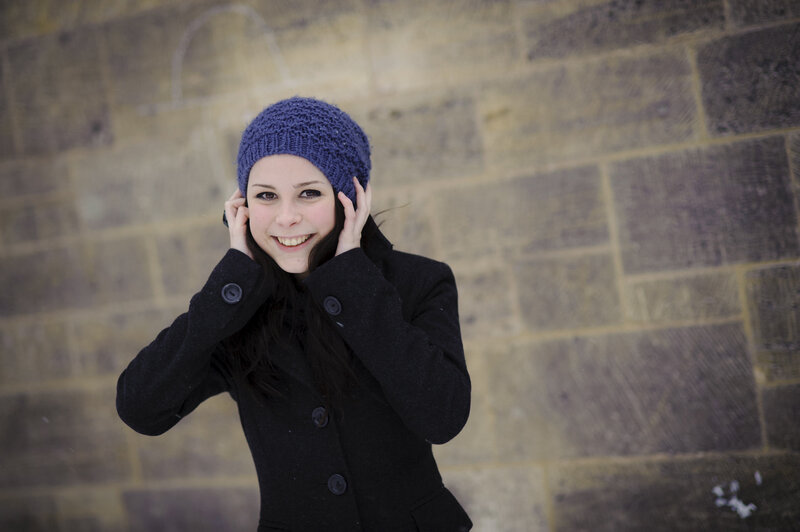 woman in winter hat smiling