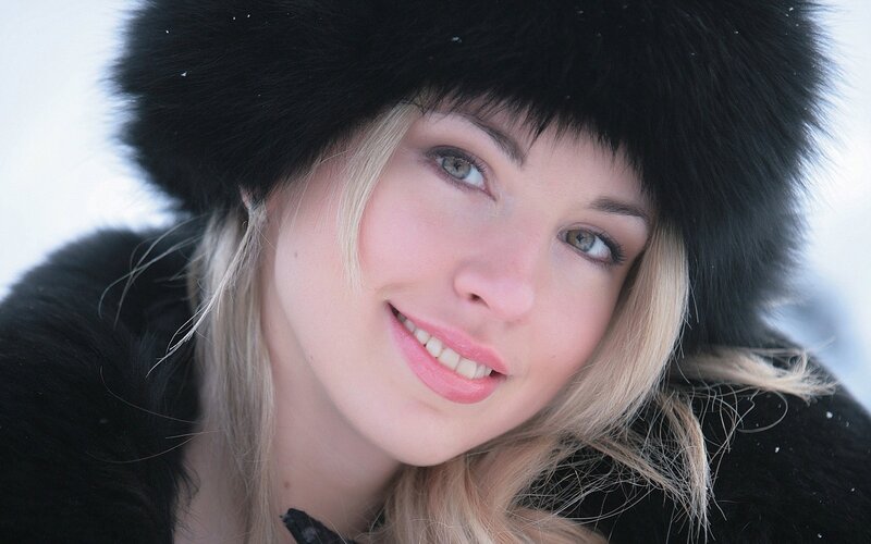 woman in winter hat smiling