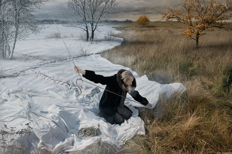Woman in winter landscape with stick