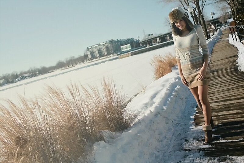 Woman in winter on a boardwalk