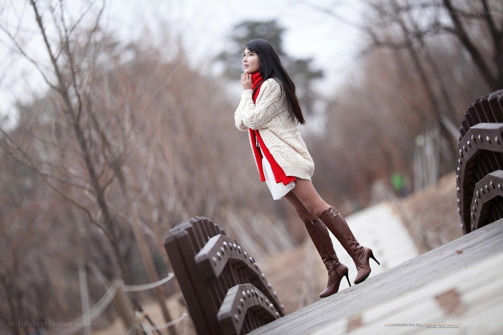 Woman in winter on a bridge