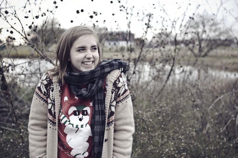 woman in winter sweater smiling