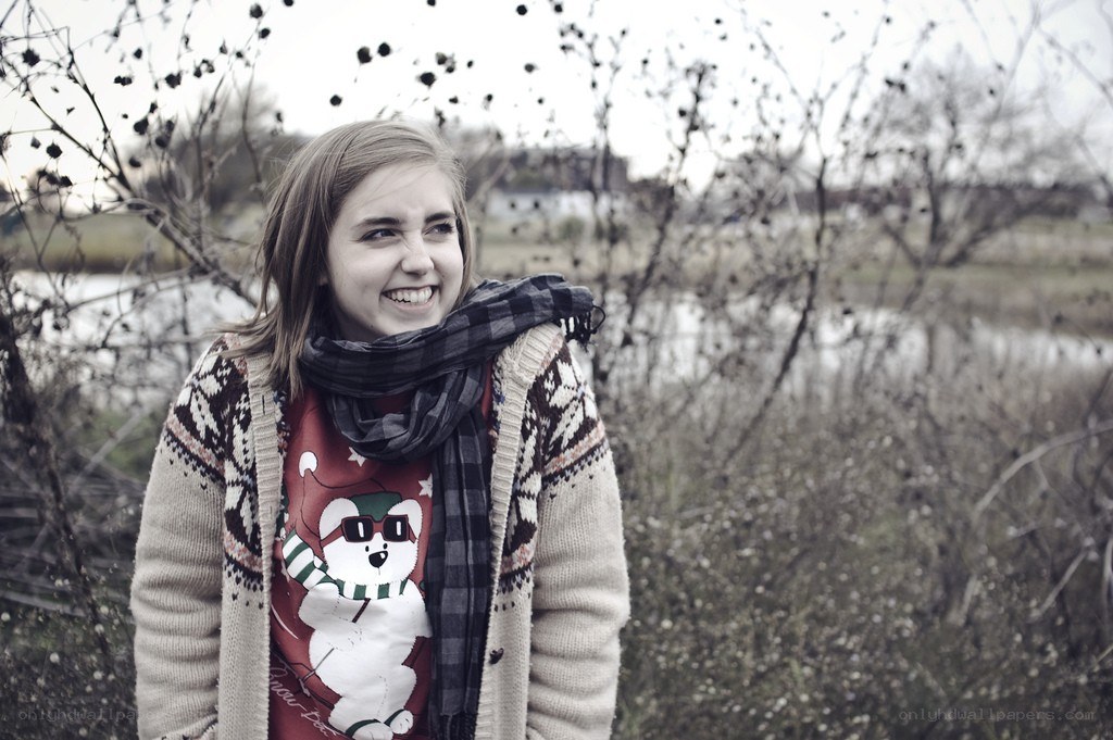 woman in winter sweater smiling