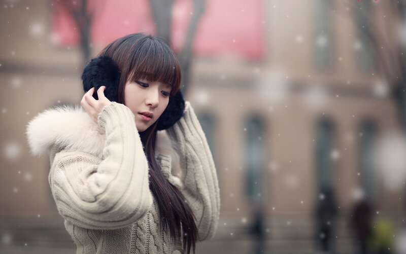 Woman in winter with earmuffs