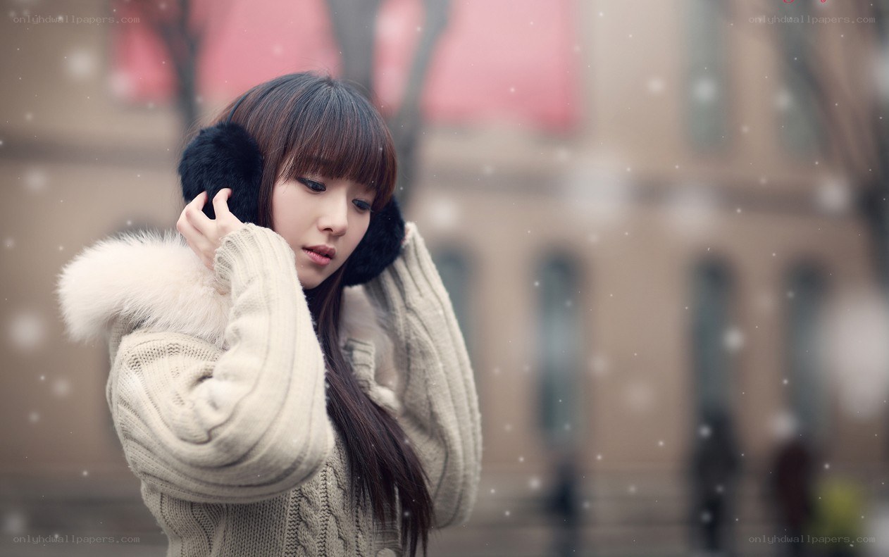Woman in winter with earmuffs