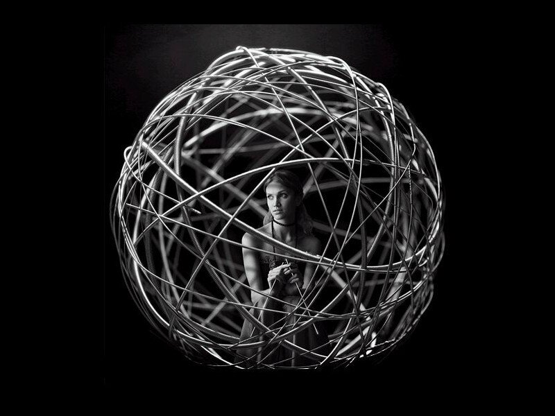 woman in wire sphere
