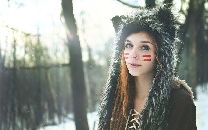 woman in wolf hat with face paint